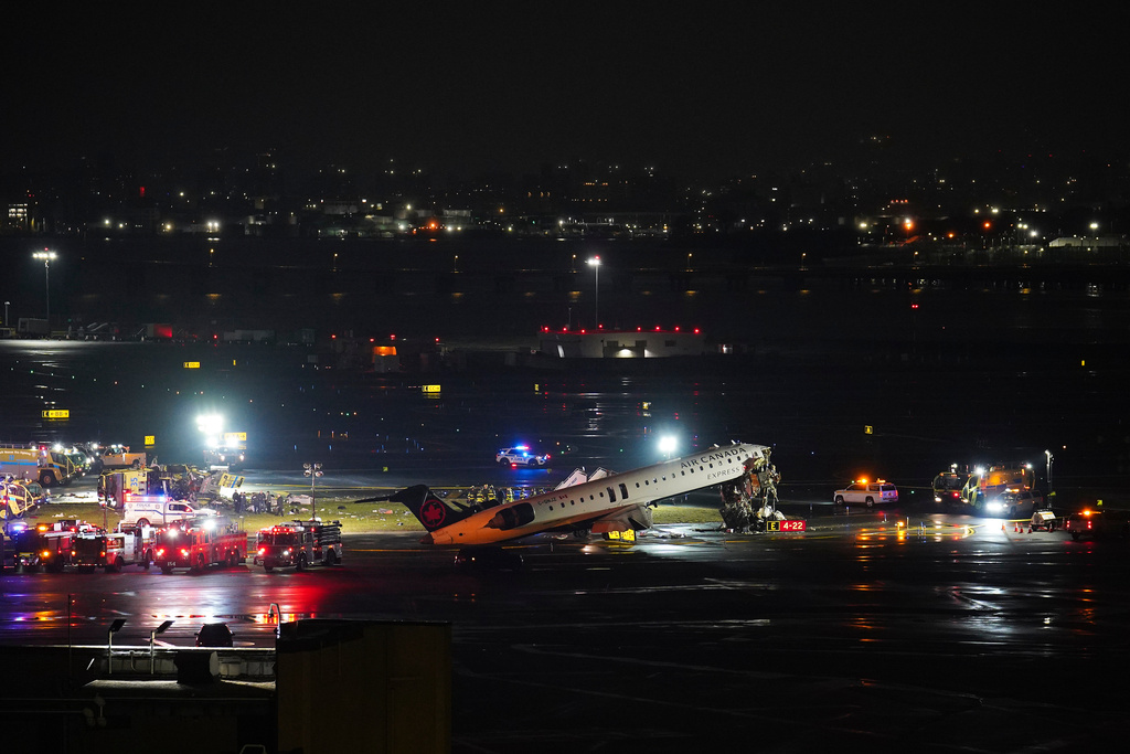 Pilot and copilot killed in collision between jet and fire truck at New York’s LaGuardia Airport